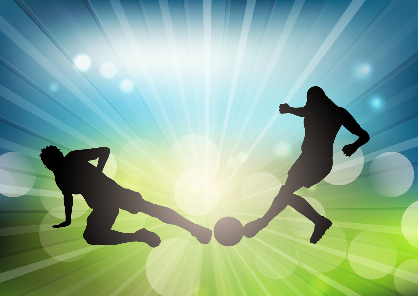 Soccer or football player silhouettes on a defocussed background
